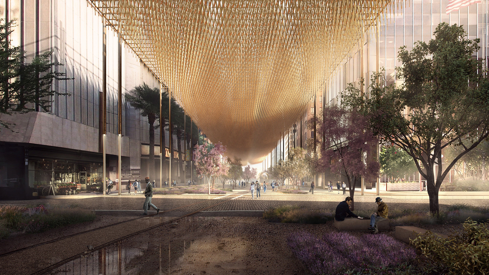 Outdoor plaza between buildings, with trees and an overhead covering
